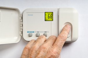how to replace the batteries in a thermostat