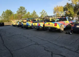 Fleet of Pruett Air Conditioning service trucks parked together