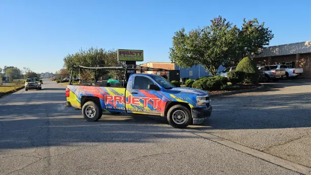 Pruett Air Conditioning truck driving along a road