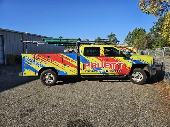 Pruett Air Conditioning truck parked on asphalt side profile Pruett Air Conditioning truck parked on asphalt side profile