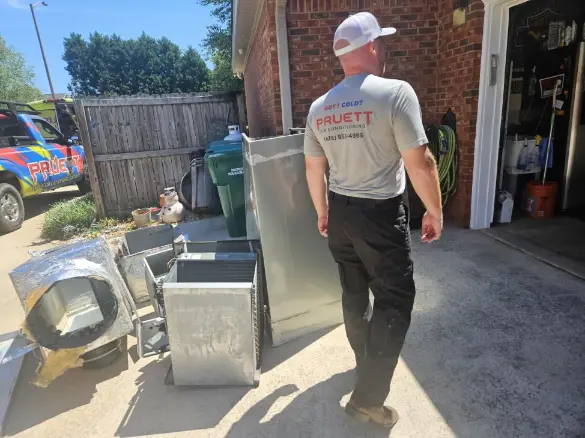 fixing aircon HVAC technician performing maintenance check on rental property AC unit