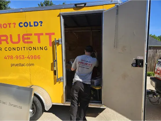 storage Air conditioner technician servicing an outdoor HVAC unit