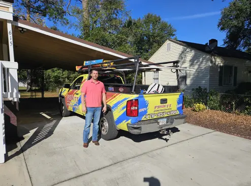 pruett-air-conditioning-service-truck-residential-driveway