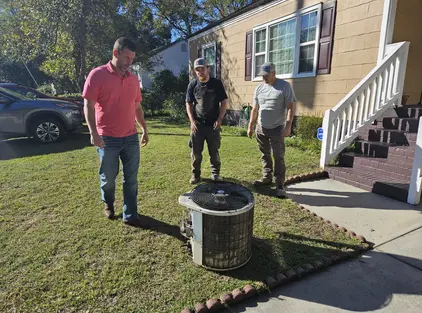 pruett-air-conditioning-technicians-inspecting-old-condenser pruett-air-conditioning-technicians-inspecting-old-condenser