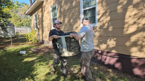 pruett-air-conditioning-technicians-removing-old-ac-unit pruett-air-conditioning-technicians-removing-old-ac-unit